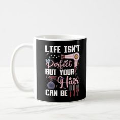 a coffee mug with the words life isn't perfect but your hair can be