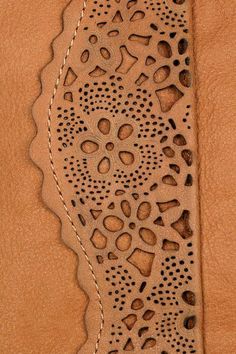 a piece of leather with an intricate design on it