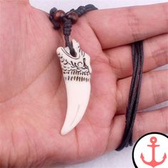 The Perfect Accessory for Sea Lovers: Shark Tooth Necklace Men If you're a passionate lover of the sea and its various symbols, our Shark Tooth Necklace Men is a must-have accessory for you. Crafted with meticulous attention to detail, this necklace represents the power and mystery of the ocean. Its unique design is inspired by the elegance and strength of sharks, making it a distinctive piece that will undoubtedly catch everyone's attention. Shark necklace is one of our sought-after collections Wolf Fangs, Wolf Tooth Necklace, Wolf Tooth, Wolf Teeth, Shark Necklace, Rock Necklace, Shark Tooth Necklace, Tooth Necklace, Necklace Men