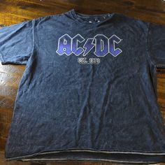 From Junk Food, This Tee Features: Mineral Wash Fabrication Crew Neckline Short Sleeves "Ac/Dc Est 1973" Verbiage Printed On Front Oversized Fit Pull On Styling Cotton Machine Wash/ Line Dry Purple Grunge T-shirt With Letter Print, Purple Cotton Band Merch Tops, Purple Band Merch Tops With Graphic Print, Purple Band Merch Top With Screen Print, Purple Graphic Print Band Merch Tops, Purple Graphic Print Tops Band Merch, Grunge Purple Top With Screen Print, Purple Grunge Top With Screen Print, Purple Grunge Screen Printed Top