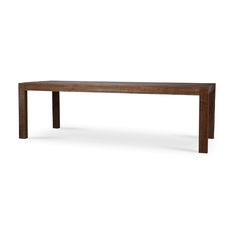 a long wooden table sitting on top of a white floor