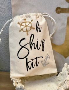 a bag with the words oh ship's kit written in black ink on it