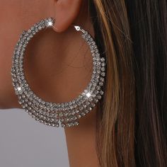 Expertly crafted with multiple rows of shimmering rhinestone crystals, these silver hoop earrings add a touch of elegance and sophistication to any outfit. Illuminate your look and make a statement with these stunning earrings. Rhinestone Hoop Earrings, Bling Earrings, Fashion Geometric, Crystal Hoop Earrings, Bra Lace, Hip Hop Jewelry, Seamless Bra, Diamond Hoop Earrings, Stunning Earrings