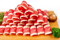 several pieces of raw meat stacked on top of each other