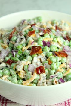 a white bowl filled with salad on top of a table