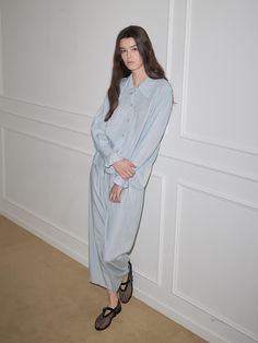 This pajama set features a relaxed fit for comfortable wear experience and shirt design exuding modern and classic mood.- Available in 2 colors: white and blue- Ruffle details at the sleeve to add appeal to the item- Made from a blended fabric with soft touch Casual Button-up Sleepwear For Lounging, Light Blue Relaxed Fit Sleepwear For Loungewear, Relaxed Fit Light Blue Sleepwear For Loungewear, Relaxed Fit Button-up Loungewear Sets, Light Blue Relaxed Fit Sleepwear For Summer, Elegant Long Sleeve Tops For Lounging, Blue Relaxed Fit Loungewear Sets, Chic Loungewear Sets With Button-up, Blue Relaxed Fit Lounging Sets