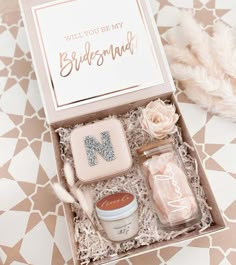 the bridesmaid gift box is filled with personal care items