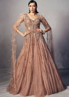 Heavily embellished rouge shimmer tulle jacket paired with tulle lehenga accentuated with long cape sleeves sprinkled with feathers and crystals. Tulle Lehenga, Jacket Lehenga, Tulle Jacket, Rahul Khanna, Long Cape, Nehru Jackets, Cape Sleeves, Western Wedding, Wedding Service