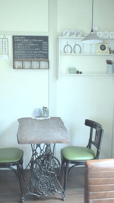 two chairs and a table in a room