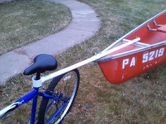 a bike with a red boat on the front and blue rear wheel attached to it