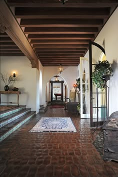 the hallway is clean and ready for guests to use it as an entrance way in this home