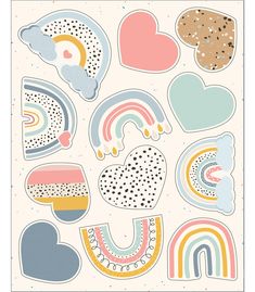 an assortment of stickers with hearts, clouds and rainbows on them in pastel colors