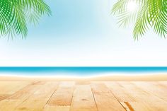 an empty wooden floor with palm trees on the beach