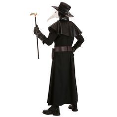 a man in a black costume with a hat and cane holding an ax on his left hand