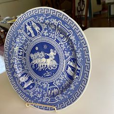 a blue and white plate sitting on top of a table