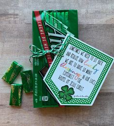 a st patrick's day card and candy bar wrapper on a wooden table