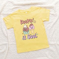 Looking for a cute tee for your kids? We have the perfect Keepin' It Cool Ice Cream graphic tee addition to their closet! Also available in youth tees. Cream Graphic Tee, Ice Cream Graphic, Cool Ice Cream, Trending Graphic Tees, Ice Cream Print, Bow Shorts, Kids Outfits Girls, Top Graphic Tees, Printed Ties