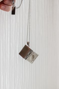 For our book lovers👀 This locket is a fully functional locket, so it opens and closes and you can add any keepsakes or photos inside to make it all the more meaningful! This necklace is made of solid stainless steel and is completely tarnish proof and high quality, so you know that means it's hypoallergenic and nickel free! This is the perfect gift for all our book lovers, writers, and academia girlies! This locket comes in with a 20 inch necklace chain. Spiritual Stainless Steel Locket Jewelry, Engraved Stainless Steel Locket Necklace As Gift, Engraved Stainless Steel Locket Necklace For Gifts, Spiritual Nickel-free Locket Necklace Gift, Nickel-free Spiritual Locket Necklace As Gift, Spiritual Metal Locket Necklace For Gifts, Personalized Metal Locket Necklace Keepsake, Personalized Metal Locket Necklace For Keepsake, Stainless Steel Locket Necklace For Keepsake