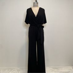 This Short Sleeve Jumpsuit Made With Stretchy Fabric Will Make You Feel Comfortable For A Night Out Or At A Wedding. There Is Also Waist Loops For A Sash Or You Can Replace It With A Belt. Size S, Runs Big. New Without Tags. Elegant Solid Color Jumpsuits And Rompers For Going Out, Elegant Jumpsuits And Rompers For Night Out, Elegant Spring Loungewear Bodysuit, Elegant Bodysuit For Spring Loungewear, Elegant Spring Bodysuit For Loungewear, V-neck Jumpsuits And Rompers For Evening, Stretch V-neck Jumpsuit For Evening, Evening Stretch Jumpsuit With V-neck, Black V-neck Jumpsuits And Rompers For Evening