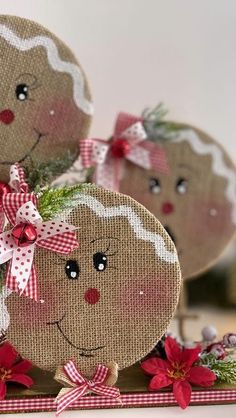 two gingerbread man and woman ornaments with poinsettis