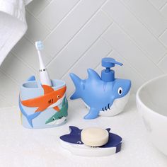 toothbrush holder, soap dispenser and toothpaste dish in bathroom