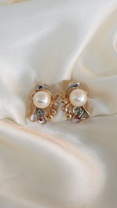 * Earring Material: Pearl, Emerald, Ruby, Sapphire, 14K Yellow Gold * Earring Dimensions: 0.75x0.5 Inch * Stone Weight & sizes: Pearl - 8-8.1MM, Emerald - 0.02ct, Sapphire -0.03ct, Ruby-0.03ct * Overall weight: 7.6g * Earring material: 14k yellow gold, Omega Post Lever Back Multi-stone White Gold Earrings For Formal Occasions, Elegant Multi-stone Diamond Earrings For Formal Occasions, Evening Multi-stone Round Earrings, Luxury Multi-stone Earrings For Anniversary, Elegant Multi-stone Diamond Earrings For Anniversary, Elegant Multi-stone Round Earrings, White Multi-stone Earrings Fine Jewelry, Exquisite Multi-stone Yellow Gold Earrings, Exquisite Yellow Gold Multi-stone Earrings