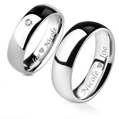 two wedding rings that say i love you and one has a diamond in the middle