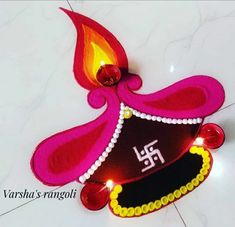 this is an image of a decorated diya with candles on it for diwaling