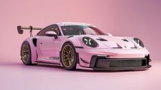 a pink porsche sports car with gold rims