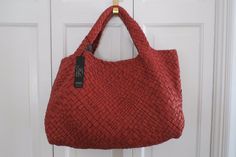 1.      Authentic FALOR Italia Woven Leather PurseTote -  Reddish Brown/Brick  – NWT - $800+ Note:  I have several FALOR bags listed – because they are hand woven and made, they vary slightly in size – please read each listing carefully.  Hard-to-find, this gorgeous FALOR large purse is in a HAND-woven leather for the entire body and the dual handles.  Smooth and textured leather.  It is striking and will be the center of attention wherever you go.  The interior is unlined.  There is a 9.5” x 6” Designer Red Bag With Braided Handles, Red Evening Bag With Intrecciato Weave, Red Intrecciato Weave Shoulder Bag For Daily Use, Red Top Handle Bag With Intrecciato Weave, Red Tote Shoulder Bag With Intrecciato Weave, Elegant Red Shoulder Bag With Intrecciato Weave, Red Intrecciato Weave Shoulder Bag For Shopping, Red Tote Bag With Intrecciato Weave, Red Woven Leather Shoulder Bag For Shopping