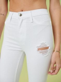 Make a bold statement in these Extreme Flare Distressed White Fashion Jeans. A pair of extreme flare jeans featuring a light distressed design, frayed raw hem, and ripped knee slits. These jeans offer two back patch pockets, faux front pockets, and a zip fly closure. Color: Extreme White Fabric: 53% Tencel, 36% Cotton, 8% T400, 3% Spandex Brand: Vibrant M.I.U. Includes: x1 Jeans Sizes: 1,3,5,7,9,11,13,15, Regular Sizing Rise: 11"Inseam: 34" White Ripped Jeans, High Rise Flare Jeans, High Waisted Flares, Love Clothing, Edgy Look, Denim Flares, Back Patch, White Fashion, Sheer Fabrics