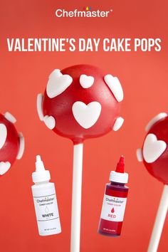 valentine's day cake pops with white hearts on them and red liquid in the middle