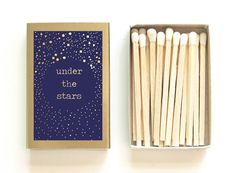 matches are in a box next to an empty matchbox that says under the stars