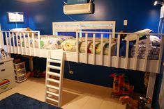 a bunk bed sitting in the middle of a room