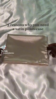 someone is laying in bed with their hand on top of the pillow that says 3 reason why you need a satin pillow case