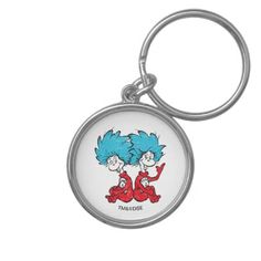 the cat in the hat keychain has two cats on it's back