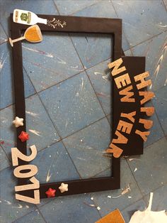 a new year's eve photo frame made out of cardboard