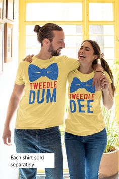 Click here for matching Tweedle Dum shirt: https://www.etsy.com/nz/listing/1069588165 This t-shirt is everything you've dreamed of and more. It feels soft and lightweight, with the right amount of stretch. It's comfortable and flattering for both men and women. * 100% combed and ring-spun cotton (Heather colors contain polyester) * Ash color is 99% combed and ring-spun cotton, 1% polyester * Heather colors are 52% combed and ring-spun cotton, 48% polyester * Athletic and Black Heather are 90% co Couples Halloween Shirts, Tweedle Dee And Tweedle Dum, Tweedle Dee Tweedle Dum, Tweedle Dum, Tweedle Dee, Matching Halloween, Couples Halloween, Halloween Shirts, Halloween Tshirts