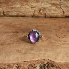 *LBJ is moving this week to a new studio in Baltimore! There may be a slight delay in your order by a day or so while we get settled* This is a perfect dainty amethyst ring - .925 Sterling Silver - Amethyst - Lavender Amethyst Sometimes you want to gaze down at your ring and see perfect balance and grace. That's what the Delica Dainty Ring has to offer. High- grade Amethyst with a simple, sterling silver design. Perfect little ring. Lovely, traditional, dainty ring of 10 x 12mm Amethyst cabochon Classic Amethyst Purple Rings, Amethyst Birthstone Ring With Gemstone, Oval Amethyst Cabochon Ring, Classic Purple Cabochon Rings, Classic Amethyst Cabochon Ring, Oval Purple Amethyst Ring, Classic Cabochon Amethyst Ring, Adjustable Oval Purple Amethyst Ring, Lavender Amethyst Ring In Oval Sterling Silver