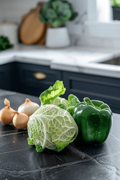 some vegetables are sitting on a counter in the kitchen