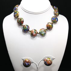 "*Description: This is a gorgeous 1930s millefiori Venetian Murano glass necklace and clip earrings with aventurine gold stone throughout. The necklace is very unique with the fifteen round flattened glass beads and its box clasp that matches the beads. The name millefiori in Italian means \"thousand flowers\". The addition of aventurine gold stone gives the necklace its gold glitter appearance. The earrings match the beads on the necklace with a slightly smaller size. The beads on the necklace Vintage Czech Glass Jewelry For Party, Vintage Multicolor Cabochon Jewelry, Retro Round Beaded Glass Jewelry, Vintage Multicolor Clip-on Jewelry, Vintage Multicolor Murano Glass Jewelry, Vintage Glass Jewelry With Round Beads, Vintage Glass Cabochon Jewelry, Vintage Multicolor Czech Glass Jewelry, Vintage Murano Glass Jewelry For Jewelry Making