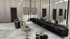 an empty salon with mirrors and chairs