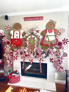 a fireplace decorated with gingerbreads and candy canes