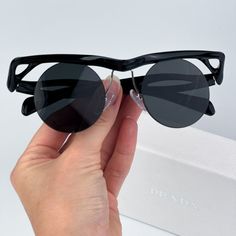 Prada Pra24s 1ab5s0 Brand New Sunglasses Black Dark Grey Round Unisex Brand New And 100% Authentic! Made In Italy. Same/Next Day Shipping! Brand: Prada Model: Pra24s / 0pr A24s Color Code: 1ab5s0 Gender: Men / Unisex Frame Colour: Black Frame Shape: Round Frame Style: Semi Rim Frame Material: Injected Plastic Lens Color: Dark Grey Lens Material: Nylon Uv Protection: Category 3 Size: 43x22x145 100% Uv Protection Full Retail Prada Set Includes: 1. Glasses 2. Case 3. Cleaning Cloth With Brand Logo Modern Black Rimless Sunglasses, Designer Black Rimless Sunglasses, Chic Black Rimless Sunglasses, Prada Model, New Sunglasses, Round Frame, Color Code, Dark Black, Cleaning Cloth