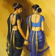 two women in blue sari holding hands