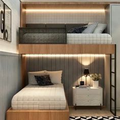 a bed room with a neatly made bed next to a shelf filled with pillows and blankets