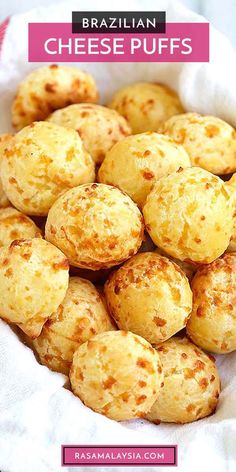 some type of cheese puffs in a white bowl on a red and white cloth