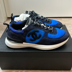 100% Authentic Chanel Sneakers Blue 38.5. New. Comes With Box, Dust Bags And Extra Shoe Laces Luxury Blue Sneakers With Contrast Sole, Luxury Blue Low-top Custom Sneakers, Designer Blue Custom Sneakers With Round Toe, Designer Blue Low-top Sneakers, Designer Blue Low-top Custom Sneakers, Designer Blue Lace-up Sneakers, Chanel Mules, Metallic High Heels, Dad Sandals