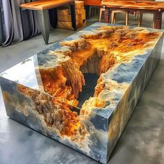 A sleek black coffee table with modern and sophisticated design. Avant Garde Interior Design, Coffee Table Designs, Epoxy Countertops, Diy Resin Table, Resin And Wood Diy, Epoxy Coffee Table, Black Coffee Table, Retail Store Interior Design, Epoxy Resin Diy