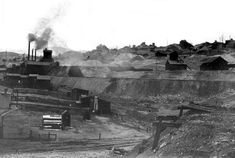 an old black and white photo of a train on tracks